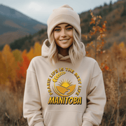 Harvest Hoodie with a beautiful graphic of a farmer's field, wheat, and a prairie sunset with the phrase Prairie Life Is The Best Life perfectly captures the essence of living in Manitoba.