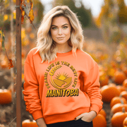 This cozy sweatshirt features a stunning graphic of a farmer's field with golden wheat and a beautiful prairie sunset. As an ode to the gorgeous Canadian province of Manitoba, this sweatshirt displays the saying "Prairie Life Is The Best Life-Manitoba."