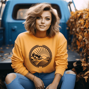 The Prairie Harvest sweatshirt has a stunning graphic of a Manitoba farmer's field during sunset, this sweatshirt is a perfect tribute to the prairie province we all love.