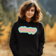 Introducing the perfect addition to your wardrobe - our trendy gender-neutral hoodie with a retro graphic and the rainbow-colored word "Winnipeg" emblazoned across the front.