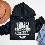 Introducing the ultimate hockey fan's dream: the 4 Out Of 5 Dentists Recommend Hockey gender neutral hoodie! Whether you're a die-hard fan or just a casual observer, this graphic hoodie is perfect for hockey season (and every season, really). With its hilarious slogan and toothy grin, this funny hockey hoodie is sure to get a chuckle out of anyone who sees it. 