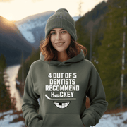 Introducing the ultimate hockey fan's dream: the 4 Out Of 5 Dentists Recommend Hockey gender neutral hoodie! Whether you're a die-hard fan or just a casual observer, this graphic hoodie is perfect for hockey season (and every season, really). With its hilarious slogan and toothy grin, this funny hockey hoodie is sure to get a chuckle out of anyone who sees it. 
