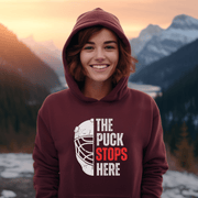 The Puck Stops Here! This hoodie is the perfect addition to any hockey player's wardrobe, or for those who just love a good laugh. With a goalie mask graphic on the front and the hilarious pun, "The Puck Stops Here", you'll feel like a true Canadian hockey superstar. 
