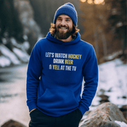 This funny hockey hoodie is the perfect gift for any hockey player or fan who loves to show off their sense of humor. Featuring the hilarious saying "Let's Watch Hockey, Drink Beer & Yell At The TV", this hoodie is sure to make everyone laugh and bring some extra fun to game day.
