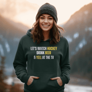 This funny hockey hoodie is the perfect gift for any hockey player or fan who loves to show off their sense of humor. Featuring the hilarious saying "Let's Watch Hockey, Drink Beer & Yell At The TV", this hoodie is sure to make everyone laugh and bring some extra fun to game day.