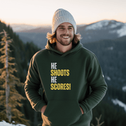 Attention all hockey players and fans! Are you looking for a gender-neutral hoodie that perfectly captures the Canadian spirit of hockey? Look no further than our "He Shoots He Scores" hockey hoodie! This funny hockey hoodie is the perfect gift for any hockey player who wants to show off their love for the game while keeping warm and looking stylish. 