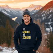 Attention all hockey players and fans! Are you looking for a gender-neutral hoodie that perfectly captures the Canadian spirit of hockey? Look no further than our "He Shoots He Scores" hockey hoodie! This funny hockey hoodie is the perfect gift for any hockey player who wants to show off their love for the game while keeping warm and looking stylish. 