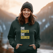 Attention all hockey players and fans! Are you looking for a gender-neutral hoodie that perfectly captures the Canadian spirit of hockey? Look no further than our "She Shoots She Scores" hockey hoodie! This funny hockey hoodie is the perfect gift for any hockey player who wants to show off their love for the game while keeping warm and looking stylish.