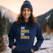 Attention all hockey players and fans! Are you looking for a gender-neutral hoodie that perfectly captures the Canadian spirit of hockey? Look no further than our "She Shoots She Scores" hockey hoodie! This funny hockey hoodie is the perfect gift for any hockey player who wants to show off their love for the game while keeping warm and looking stylish.