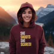 Attention all hockey players and fans! Are you looking for a gender-neutral hoodie that perfectly captures the Canadian spirit of hockey? Look no further than our "She Shoots She Scores" hockey hoodie! This funny hockey hoodie is the perfect gift for any hockey player who wants to show off their love for the game while keeping warm and looking stylish.