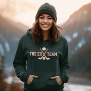 Looking for a hilarious way to show your love for Canadian hockey? Look no further than The EH Team hockey hoodie! This gender neutral hoodie is perfect for all hockey players, fans, and anyone who loves a good puck joke. Made from the comfiest material this side of the border, The EH Team hoodie will keep you warm and cozy on even the chilliest of rinks. And with its witty play on words, you'll be the envy of all your hockey buddies.