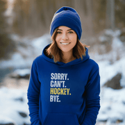 Introducing the must-have hoodie for any hockey player, fan, or enthusiast: the Sorry. Can't. Hockey. Bye. hoodie! Perfect for those chilly days at the rink or just lounging at home, this gender-neutral hoodie is sure to make everyone laugh. Featuring a bold and hilarious design with a nod to Canadian hockey culture, this funny hockey hoodie is a great gift for any hockey player.