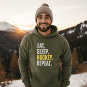 This hockey hoodie is not just any regular hoodie, it's the perfect blend of style, comfort and humor. With the catchy phrase "Eat. Sleep. Hockey. Repeat." printed on it, this hoodie is sure to grab attention and make heads turn. 
