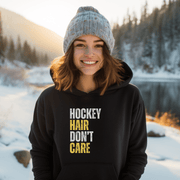 Introducing the perfect accessory for any hockey player or fan - our hilarious gender neutral hockey hoodie! This hoodie is not only stylish but also practical, with a cozy design that is perfect for keeping you warm during those chilly hockey games. Featuring the witty slogan "Hockey Hair Don’t Care", this funny hockey hoodie is the perfect way to show off your love for the game and your luscious locks
