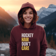 Introducing the perfect accessory for any hockey player or fan - our hilarious gender neutral hockey hoodie! This hoodie is not only stylish but also practical, with a cozy design that is perfect for keeping you warm during those chilly hockey games. Featuring the witty slogan "Hockey Hair Don’t Care", this funny hockey hoodie is the perfect way to show off your love for the game and your luscious locks