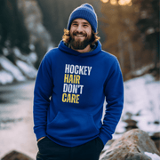 Introducing the perfect accessory for any hockey player or fan - our hilarious gender neutral hockey hoodie! This hoodie is not only stylish but also practical, with a cozy design that is perfect for keeping you warm during those chilly hockey games. Featuring the witty slogan "Hockey Hair Don’t Care", this funny hockey hoodie is the perfect way to show off your love for the game and your luscious locks