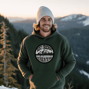 This gender-neutral hoodie is perfect for anyone who loves hockey and is proud to show it. With a graphic featuring people playing pond hockey with a stunning mountain background, this hoodie is sure to turn heads and start conversations. 