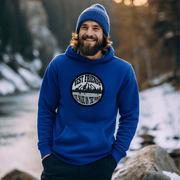This gender-neutral hoodie is perfect for anyone who loves hockey and is proud to show it. With a graphic featuring people playing pond hockey with a stunning mountain background, this hoodie is sure to turn heads and start conversations. 