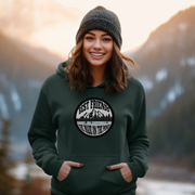 This gender-neutral hoodie is perfect for anyone who loves hockey and is proud to show it. With a graphic featuring people playing pond hockey with a stunning mountain background, this hoodie is sure to turn heads and start conversations. But this hoodie isn't just a fashion statement. It's also designed for comfort and durability. 