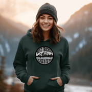 This gender-neutral hoodie is perfect for anyone who loves hockey and is proud to show it. With a graphic featuring people playing pond hockey with a stunning mountain background, this hoodie is sure to turn heads and start conversations. 