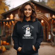 Looking for a spooky and stylish way to scare up some laughs this Halloween? Look no further than our bone-tickling Halloween Sweatshirt, featuring a ghostly nurse with a killer sense of humor! With the hilarious slogan "I Found This Humerus" emblazoned across the chest, this sweatshirt is guaranteed to have all your friends in stitches. And with its cozy fabric and comfy fit, you'll be the envy of all the ghouls and ghosts at the Halloween party. 