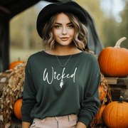 Our gender-neutral sweatshirt is the perfect addition to your spooky wardrobe, and it's guaranteed to make heads turn. With the wickedly cool design of a witch's broom and the word "Wicked" emblazoned across the front, this sweatshirt will have you feeling like the baddest witch in town. 