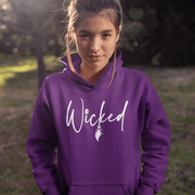 Our gender-neutral hoodie is the perfect addition to your spooky wardrobe, and it's guaranteed to make heads turn. With the wickedly cool design of a witch's broom and the word "Wicked" emblazoned across the front, this sweater will have you feeling like the baddest witch in town.