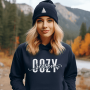 Introducing the hottest (pun intended) gender-neutral hoodie of the season - the Cozy Season Hoodie! Made with the softest material that feels like a warm hug, this hoodie is perfect for snuggling up on the couch with a big mug of hot chocolate. 