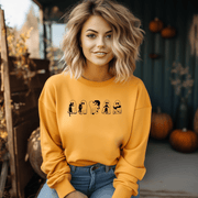  This gender-neutral sweatshirt is perfect for the upcoming Spooky Season, featuring adorable ghosts holding black cats. It's the perfect way to show off your love for Halloween, ghosts, and cats all at once.