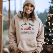 Introducing the perfect hoodie for the holiday season: our gender-neutral, ultra-cozy hoodie featuring a vintage farm truck loaded up with fresh Christmas trees