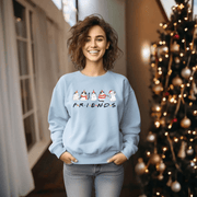 Introducing the ultimate holiday season staple: the gender-neutral sweatshirt featuring adorable Christmas Cartoon Cats and the iconic "FRIENDS" logo from the beloved TV show! 