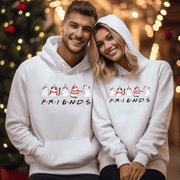 Introducing the ultimate holiday season staple: the gender-neutral hoodie featuring adorable Christmas Cartoon Cats and the iconic "FRIENDS" logo from the beloved TV show! 