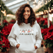 Introducing the ultimate holiday season staple: the gender-neutral hoodie featuring adorable Christmas Cartoon Cats and the iconic "FRIENDS" logo from the beloved TV show! 