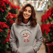 Our gender-neutral pullover features an adorable Christmas tree cake holding a sturdy Stanley water bottle, and flaunting a belt bag with a sassy message that reads "Out here lookin' like a snack". 