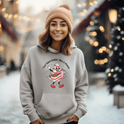 Our gender-neutral pullover features an adorable Christmas tree cake holding a sturdy Stanley water bottle, and flaunting a belt bag with a sassy message that reads "Out here lookin' like a snack". 