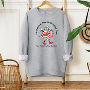 This cozy sweatshirt features an adorable Christmas tree cake holding a Stainless steel water bottle and wearing a stylish belt bag with the saying "Oh Christmas Tree, Oh Christmas Tree, How Tasty Are Your Branches", this sweatshirt is sure to get you in the festive mood.