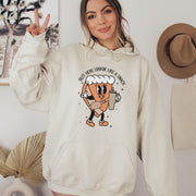 This hoodie features a cute little pumpkin pie holding a sleek Stanley water bottle while rocking a belt bag that reads “Out Here Lookin' Like A Snack." 