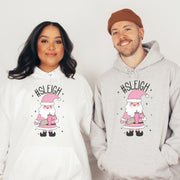 This gender neutral hoodie features a cute Santa holding a Stanley water bottle and sporting a trendy belt bag with the hashtag #SLEIGH. But wait, there's more! This hoodie is not just soft and comfortable, it's also magically warm - perfect for those cold winter nights. 