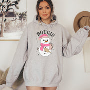 Our gender-neutral hoodie features an adorable snowman holding a Stanley water bottle. And the snowman is not just any snowman - he's bougie, or so his belt bag says!