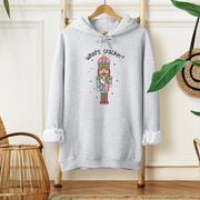 This cozy and stylish hoodie features a cute Christmas nutcracker holding a Stanley water bottle and sporting a trendy belt bag and is saying "What's Crackin'?", making this hoodie a conversation starter wherever you go.