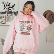 Slip into this cozy gender-neutral hoodie and feel the warmth of the cute cartoon cups of hot chocolate on your chest. It's like wearing a hug, but better because you won't overheat. 