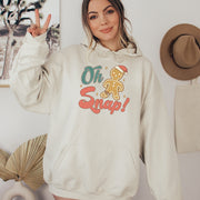 This hoodie features a cute cartoon gingerbread man with a broken leg and the hilarious phrase, "Oh Snap!" printed on the front.