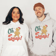This hoodie features a cute cartoon gingerbread man with a broken leg and the hilarious phrase, "Oh Snap!" printed on the front.