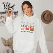  This cozy and comfortable gender-neutral hoodie is the ultimate gift for cat lovers and cupcake enthusiasts alike. Featuring adorable cartoon cats sitting in Christmas cupcakes, this hoodie is sure to bring a smile to anyone's face. 