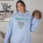 This hoodie features dancing Christmas skeletons who are tangled in Christmas lights and ready to party.