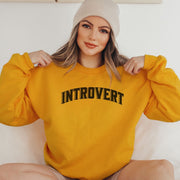 Introducing the ultimate sweatshirt for the cozy and introverted souls out there! Our gender-neutral sweatshirt features the hilarious and relatable saying "Introvert." - because let's be real, who needs a social life when you can have a Netflix marathon in your pajamas? Made with the softest and most comfortable material, this sweatshirt will feel like a warm hug from your couch.