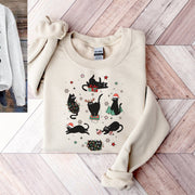 Introducing the purrfect cozy sweater for the festive season- our gender neutral black cat sweatshirt! This sweatshirt is sure to bring a smile to your face with its adorable design featuring black cats doing funny Christmas things.
