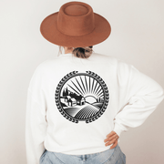 Our gender neutral sweatshirt features a stunning graphic of a Manitoba farmer's field at sunset, capturing the essence of the province's rich agricultural heritage. 