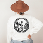 The Prairie Harvest sweatshirt features a stunning graphic of a Manitoba farmers field, paying homage to the beautiful prairie landscape.