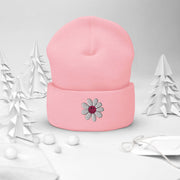 Our gender-neutral beanie is not only super cozy and comfortable to wear, but it also features an embroidered happy face daisy that will make you smile every time you put it on. 